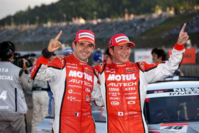 Benoit Treluyer and Satoshi Motoyama celebrate their victory