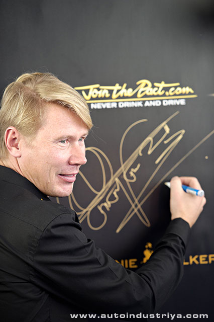 Mika poses with his signature