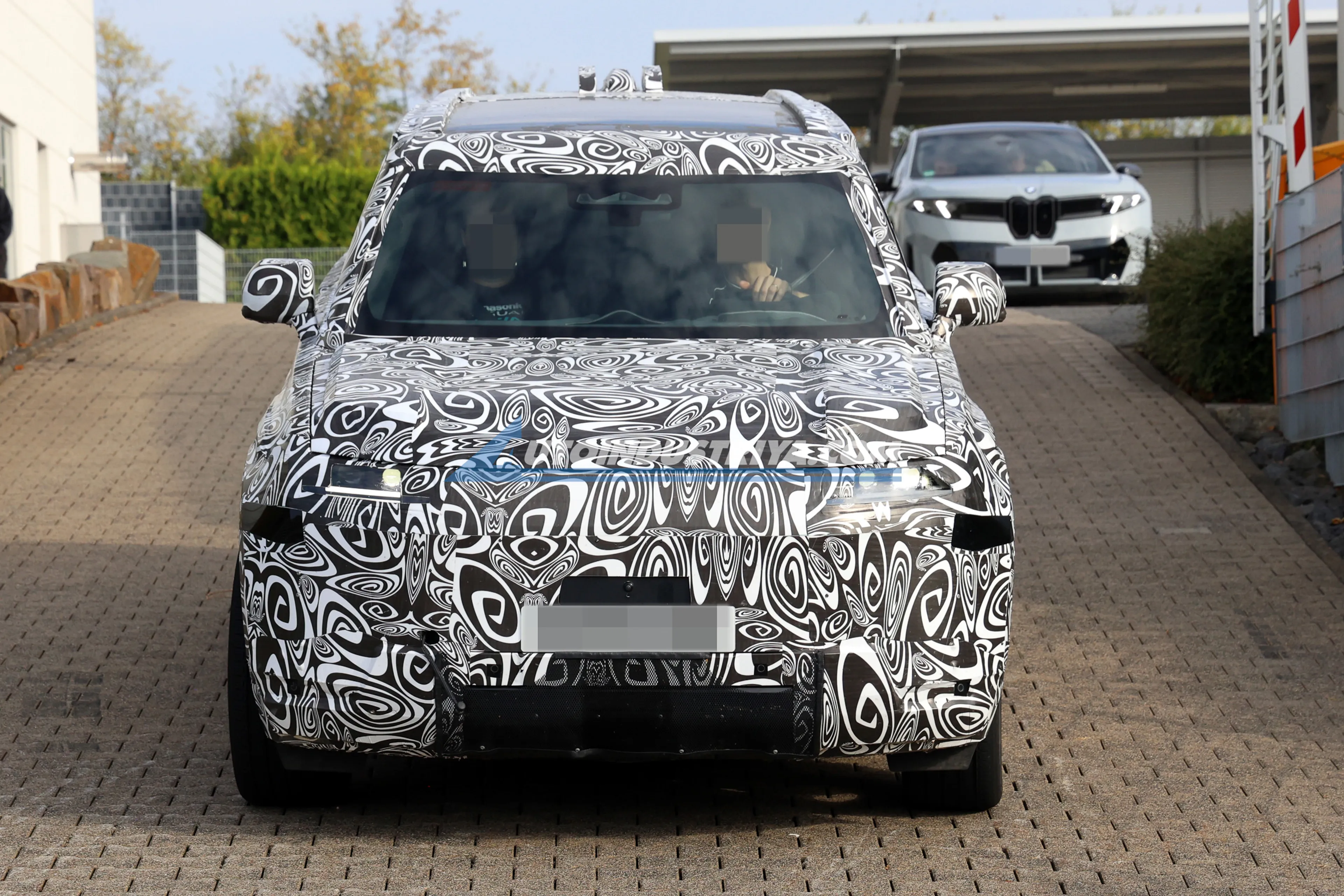 Electrified 2027 "Baby Defender" spied with rear-mounted spare wheel