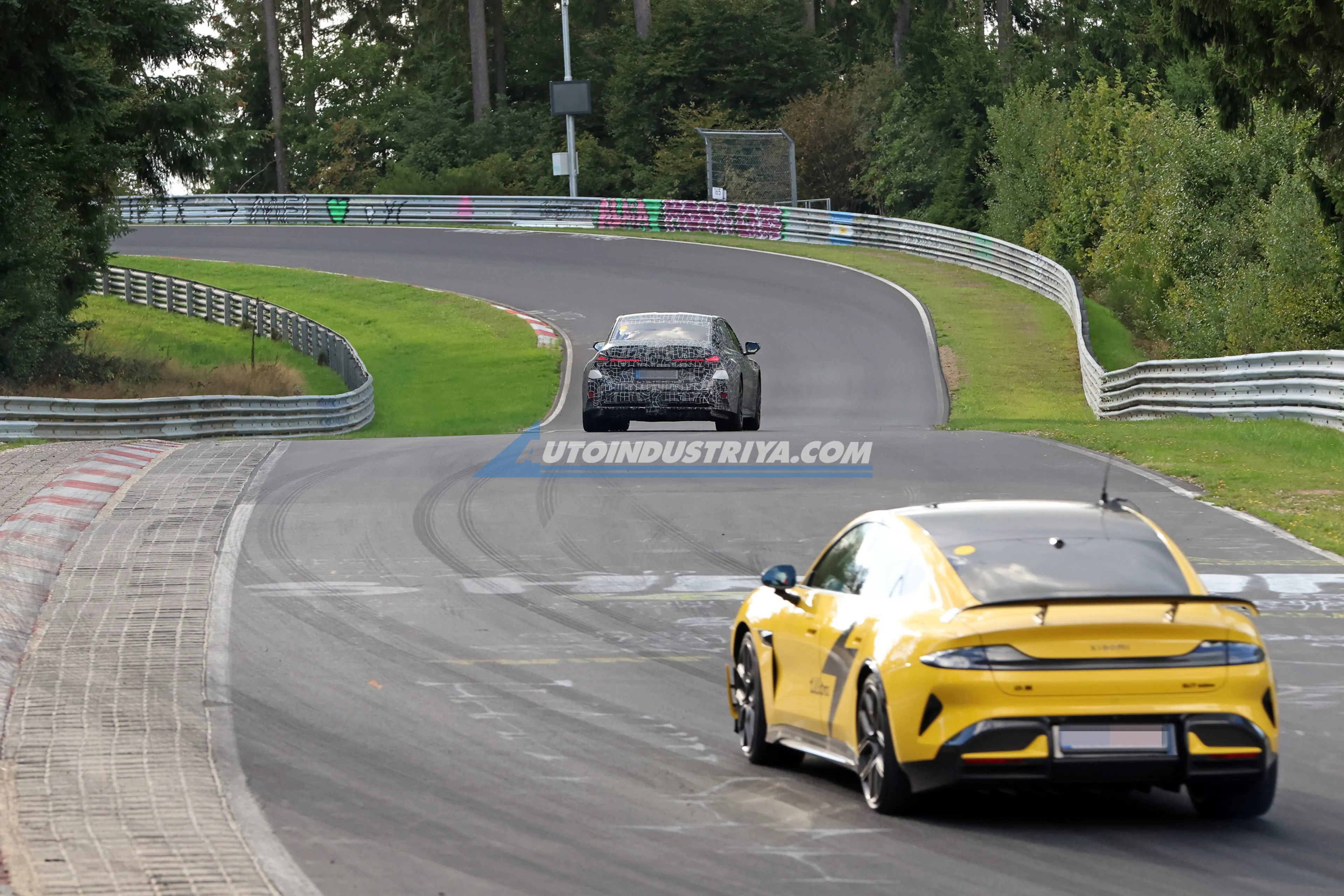 All-electric BMW M3 prototype spied tangling with Xiaomi SU7 Ultra on the track